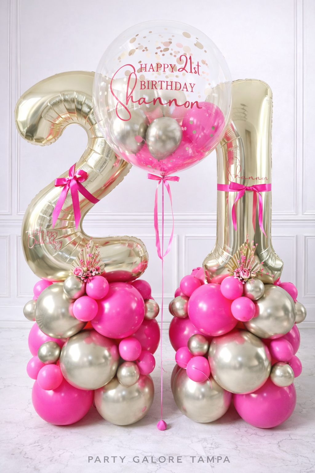 21st birthday balloon setup with pink and gold foil number balloons and custom name bubble balloon in Tampa delivery