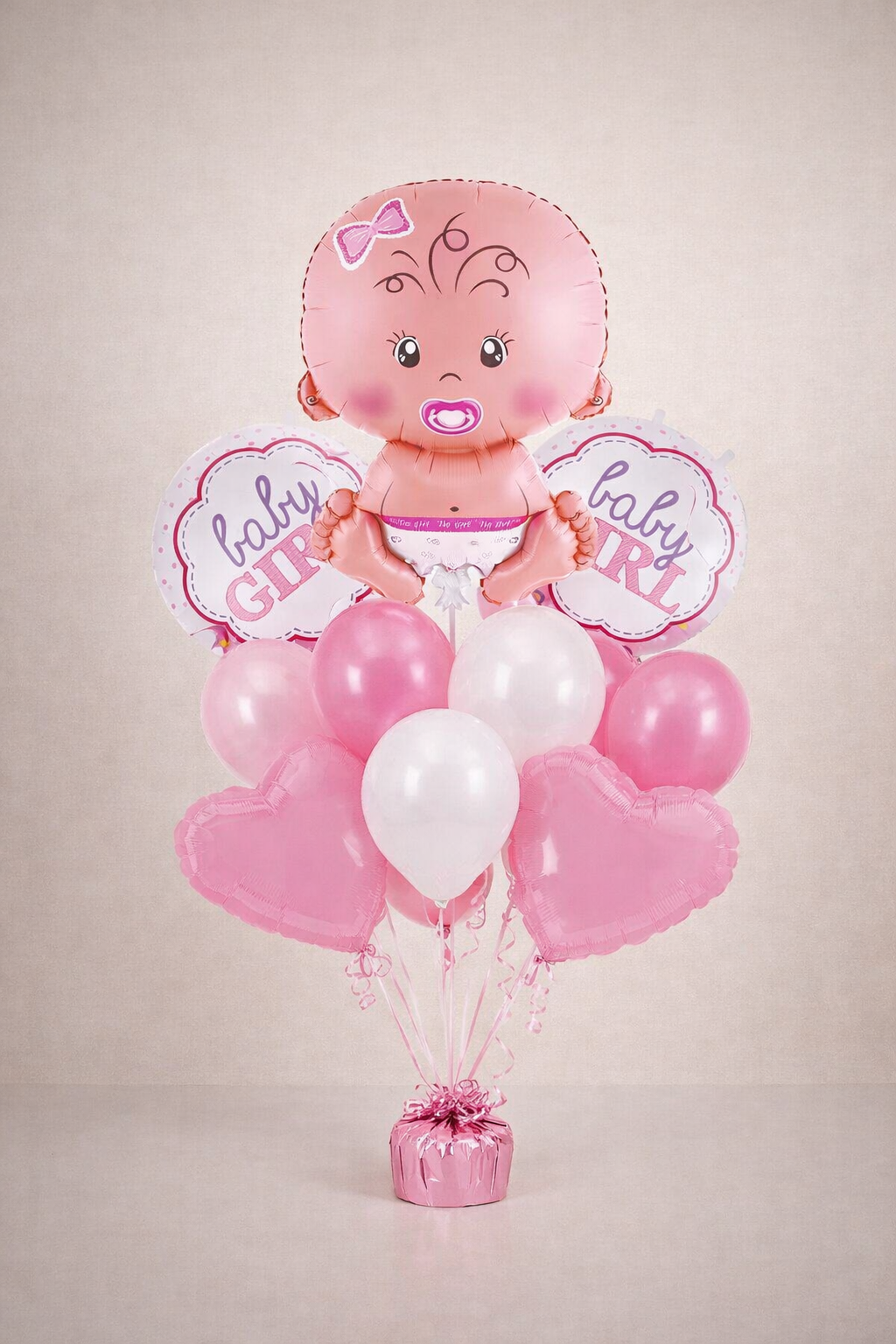 Baby girl balloon bouquet with large baby-shaped foil balloon and themed decorations for baby showers