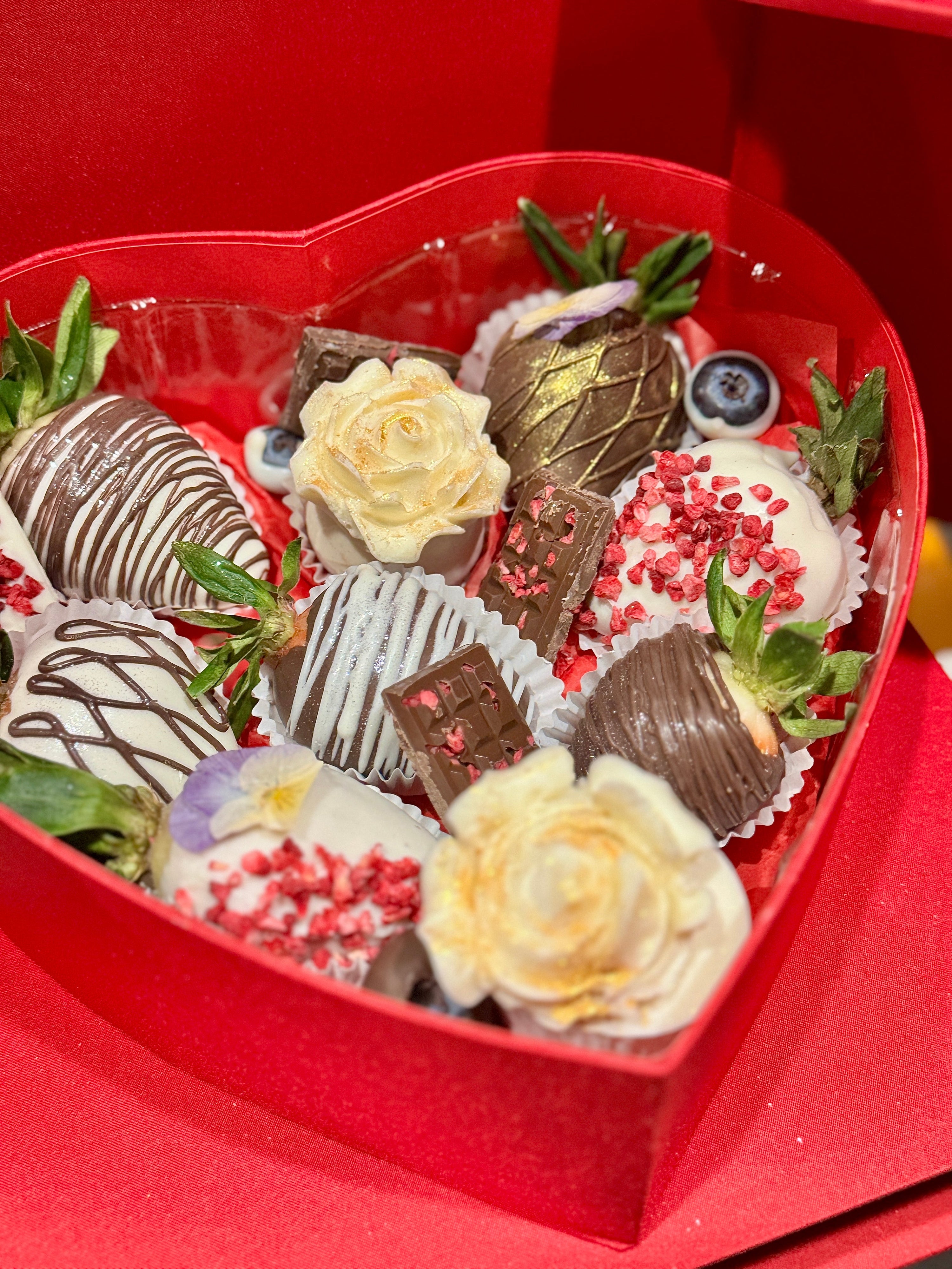 Box of chocolate covered strawberries dipped in white and semisweet chocolate