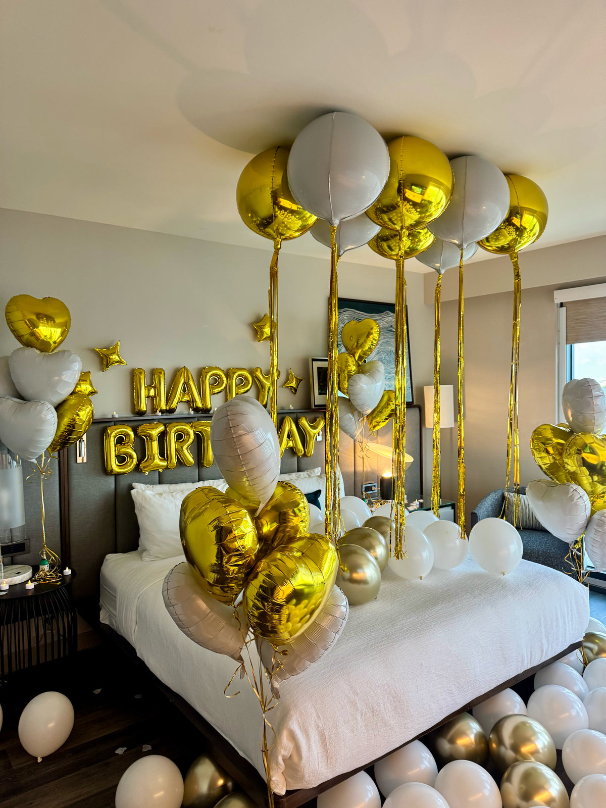 Gold and white luxury birthday hotel room decoration Tampa Florida