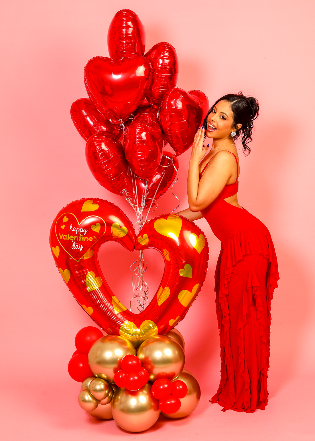 Custom Valentine’s Day balloon bouquet with red heart balloons and gold accents, ideal for romantic surprises and celebrations.