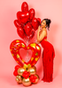 Custom Valentine’s Day balloon bouquet with red heart balloons and gold accents, ideal for romantic surprises and celebrations.