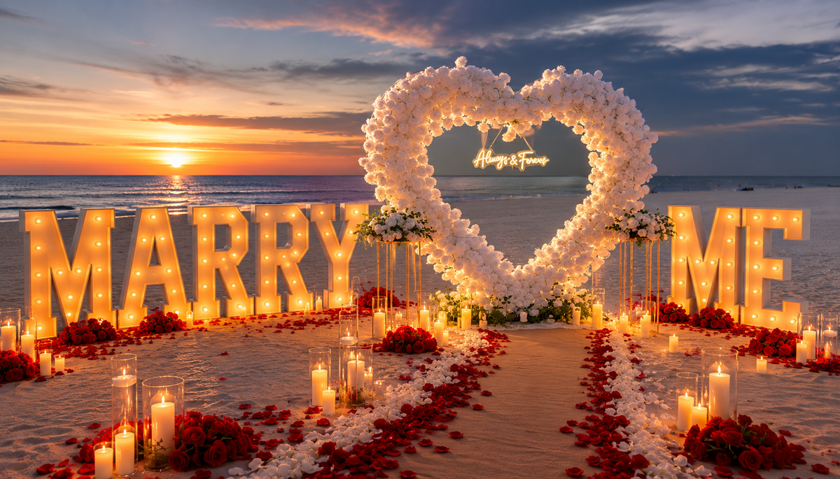 Luxury beach proposal setup with floral heart arch and Marry Me letters in Tampa