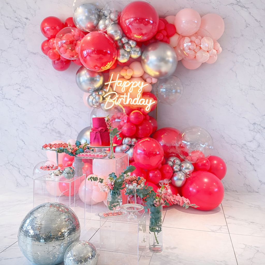 Luxury pink birthday balloon setup with acrylic stands for elegant party decor in Tampa