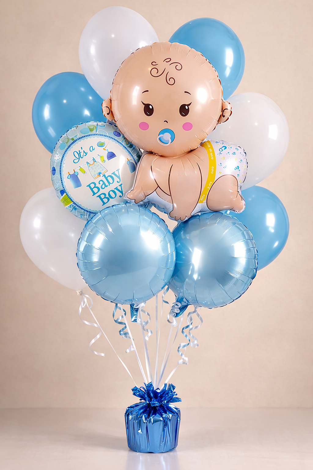 Baby shower balloon bouquet featuring baby-shaped foil balloons in blue for a baby boy celebration