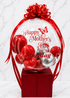 Luxury red and silver personalized Mother’s Day bubble balloon arrangement with custom name and satin bow on gift box base.