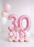 Luxury pink 33-inch birthday cake foil balloon bouquet with custom name and blush pink, white, champagne accents for milestone celebrations