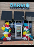 Colorful taco themed balloon garland for restaurant grand opening, Cinco de Mayo inspired balloon entrance decor , Restaurant entrance decorated with vibrant fiesta balloons