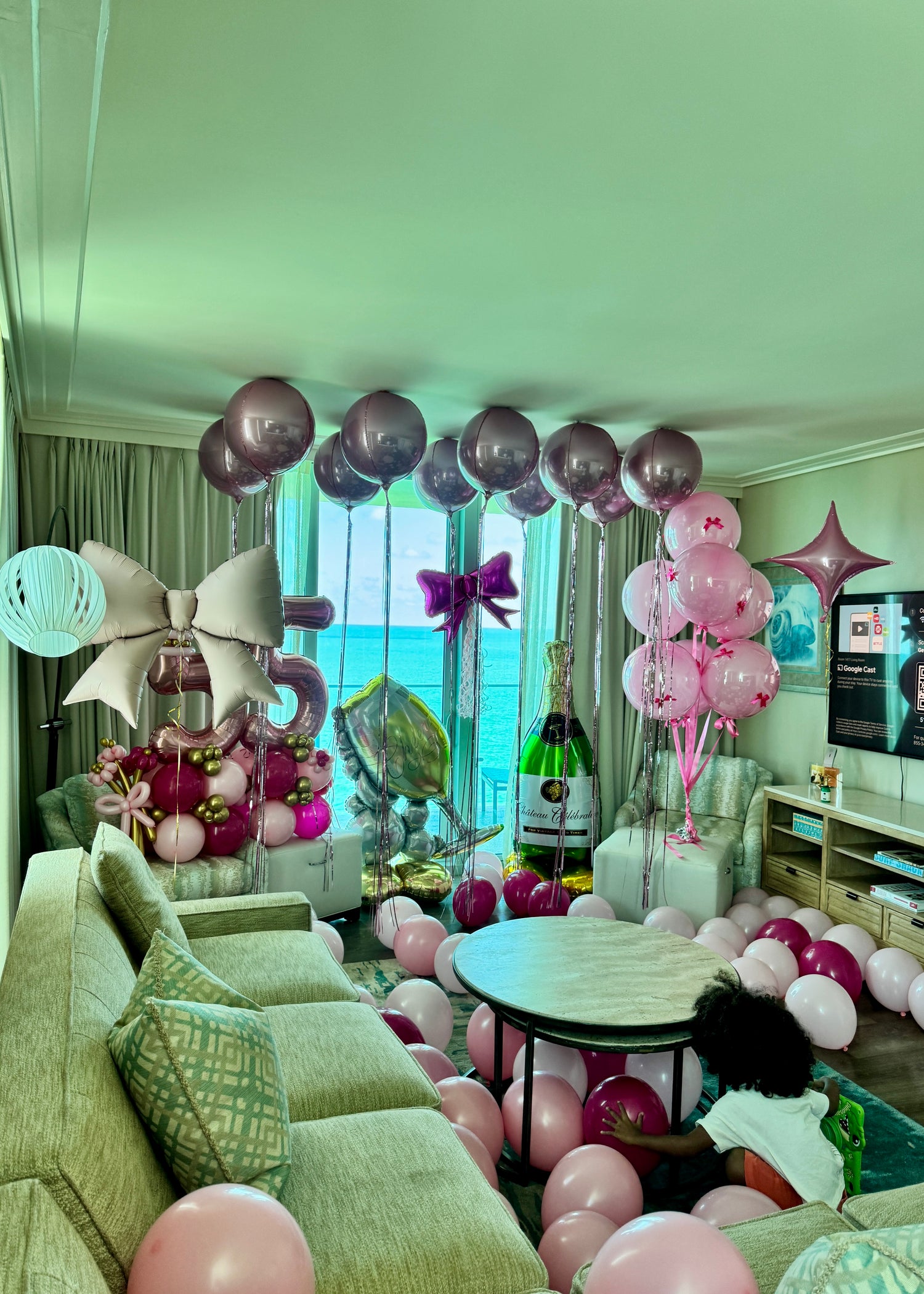 Pink birthday room surprise with helium Orbz balloons, number bouquet and floor balloons in Tampa