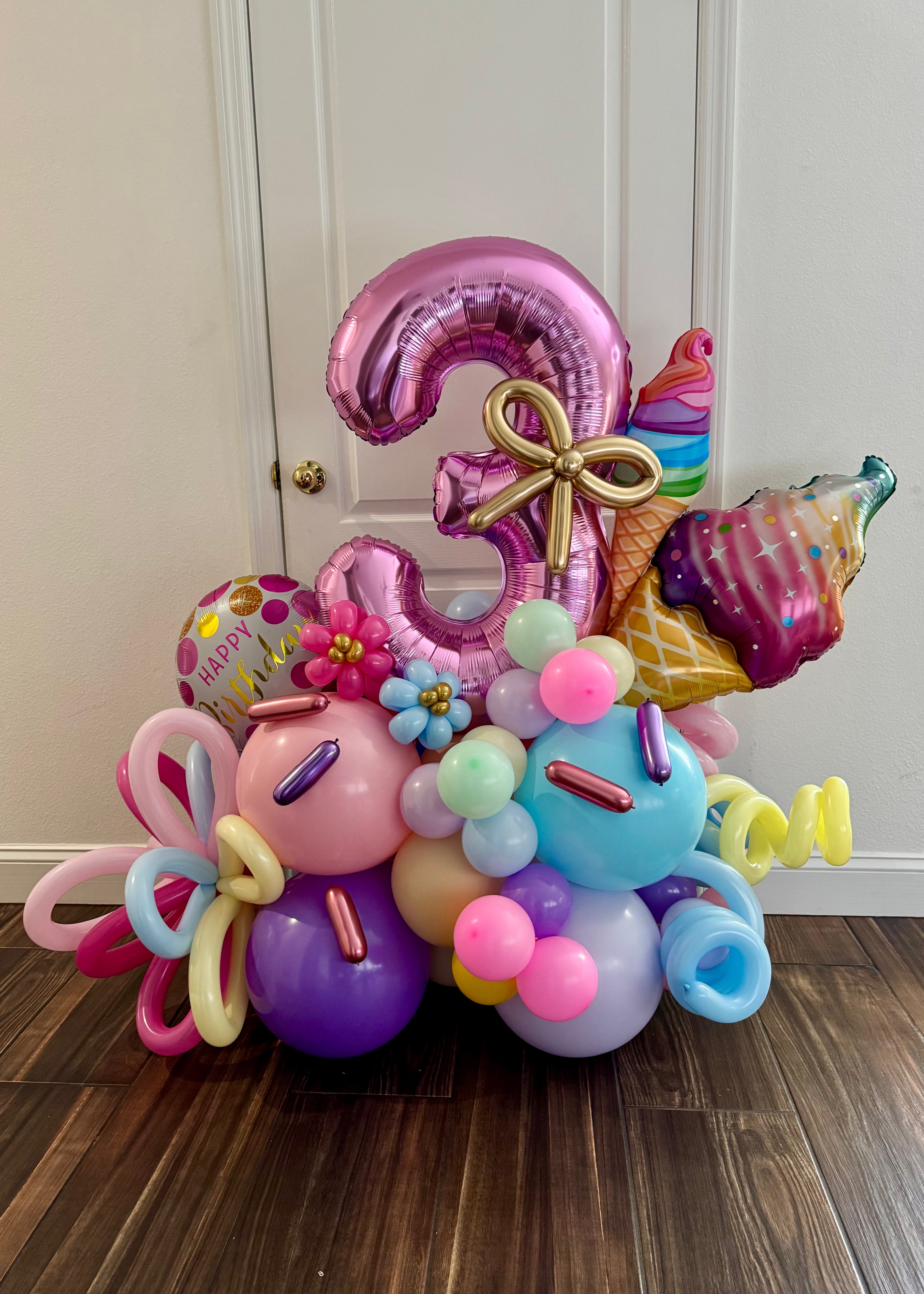 Colorful balloon arrangement with number &
