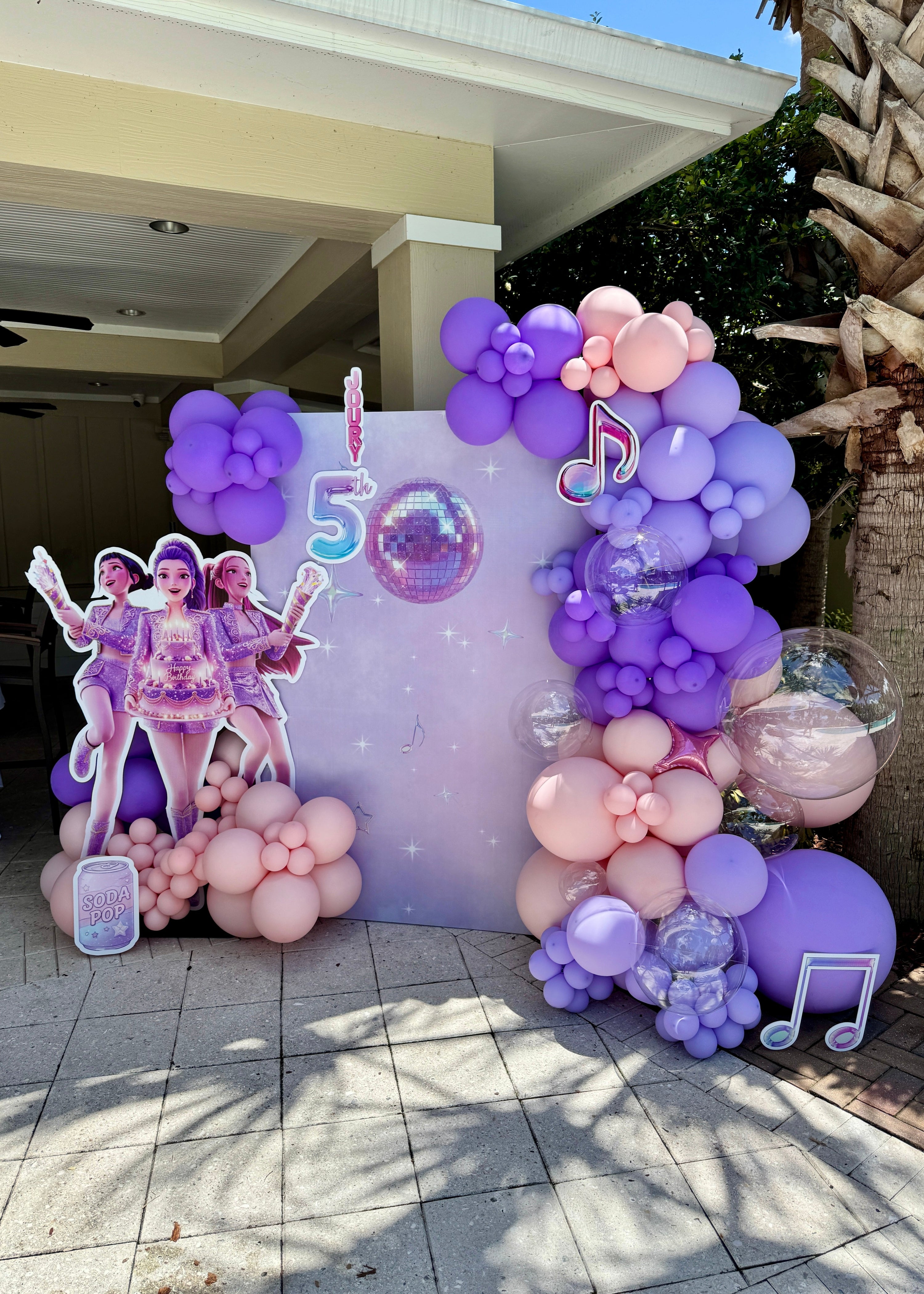 Demon Hunters anime-themed pastel balloon backdrop with luxury organic garland and character cutouts for kids&