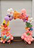 Flower pastel themed balloon garland with colorful balloons and floral decorations for celebrations