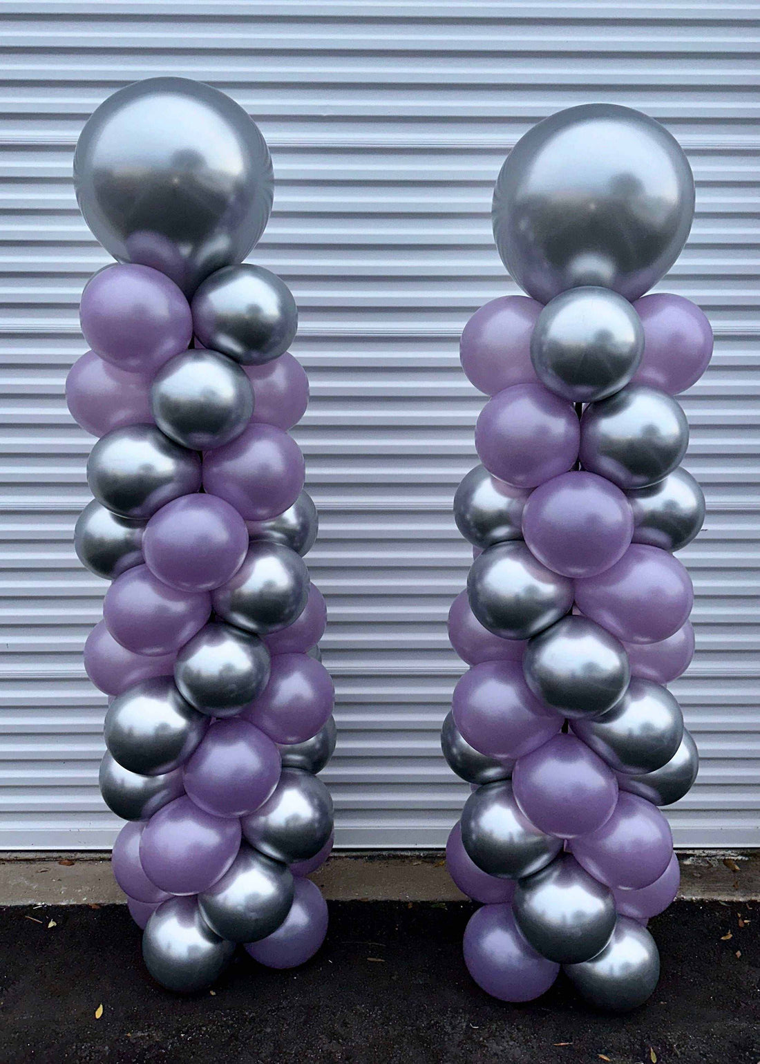 6ft tall spiral balloon columns in silver and purple for party decoration