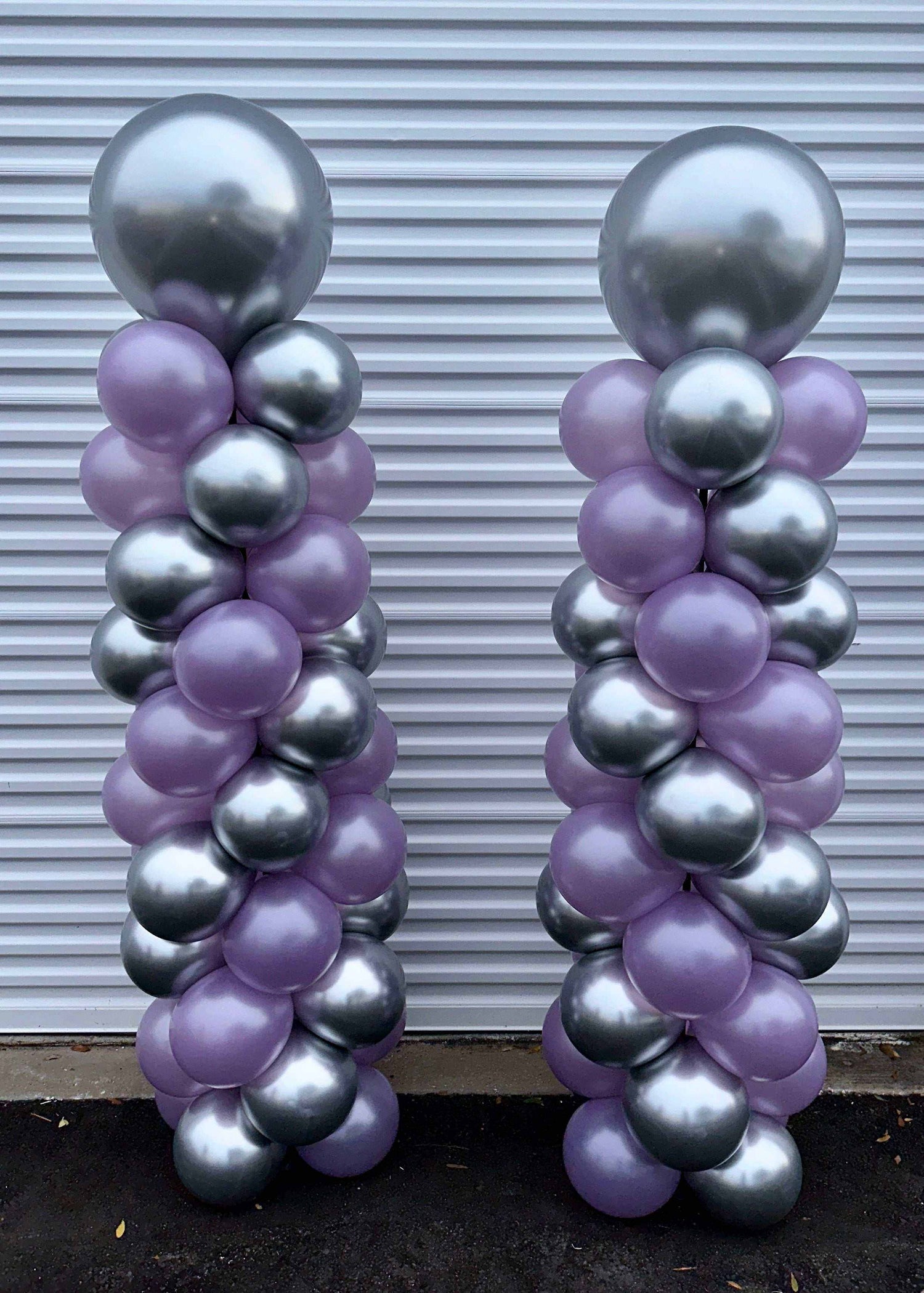 6ft tall spiral balloon columns in silver and purple for party decoration