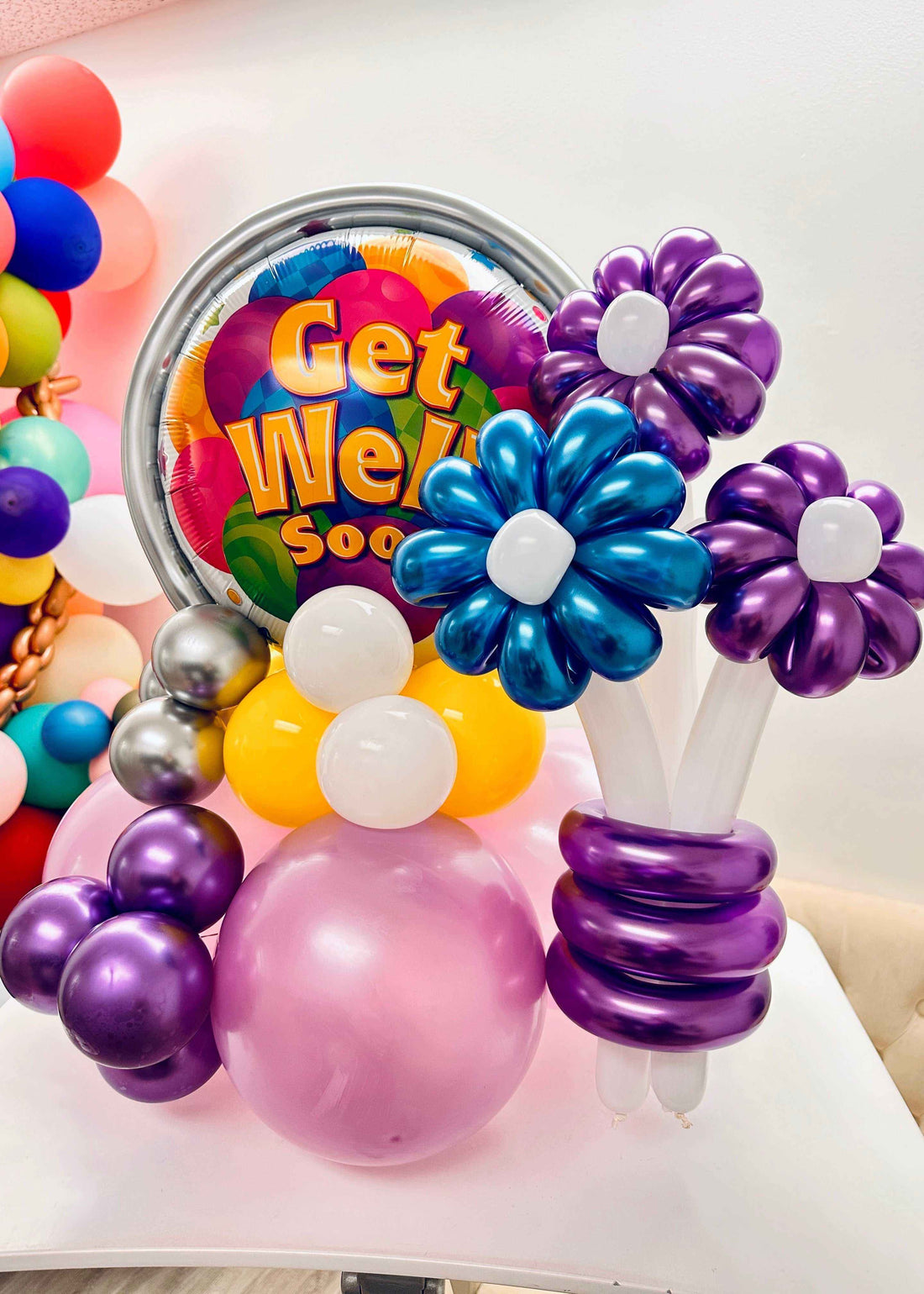 Colorful Get well Soon Balloon bouquet with vibrant flowers and cheerful message for recovery gift delivery