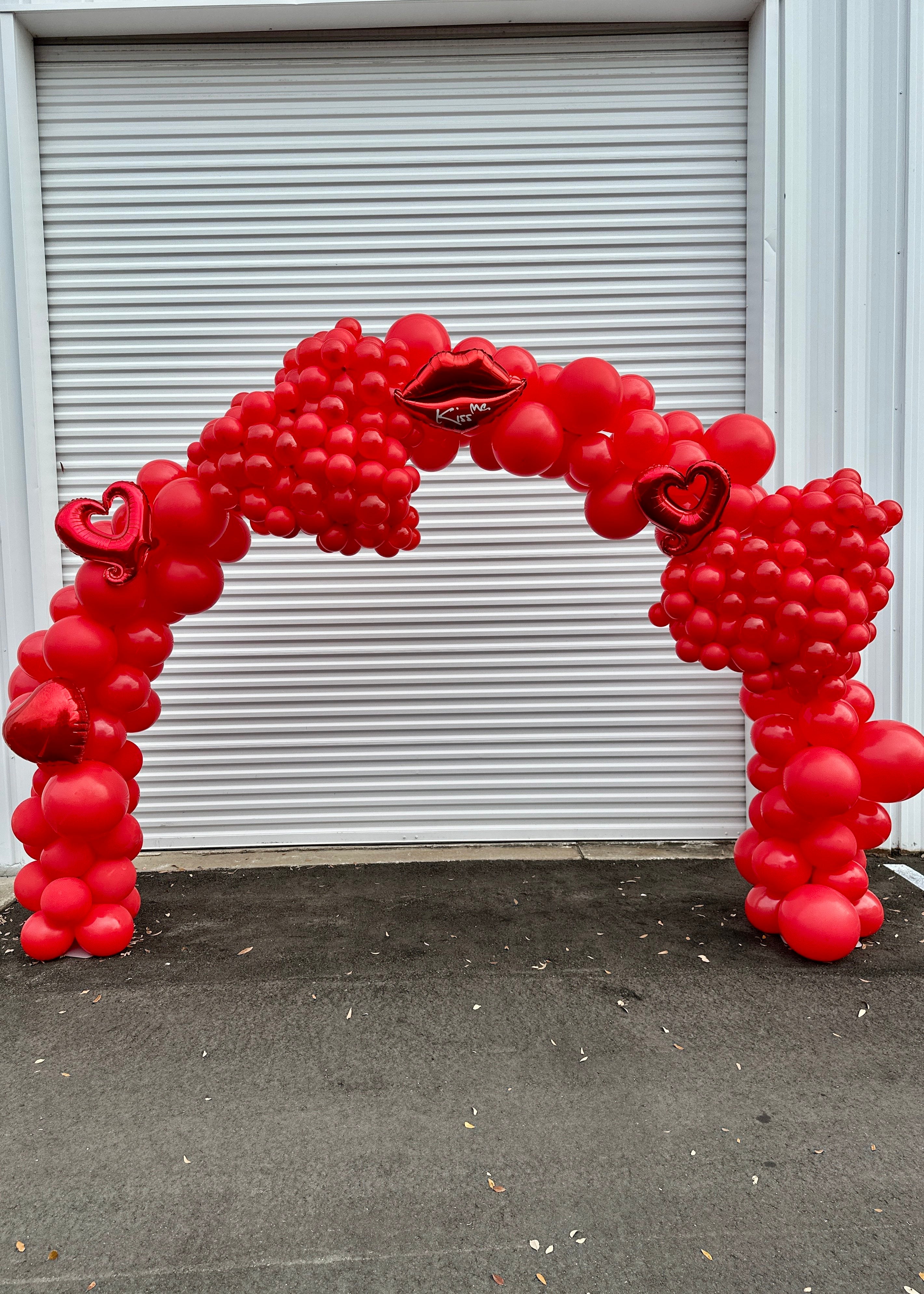 Romantic Hearts &amp; Kisses Balloon Arches by Party Galore Tampa